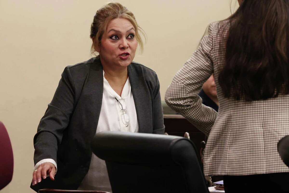 Ex-constable Michelle Barrientes Vela talks with her attorney, Jasmine Holguin, during the sentencing phase of her on tampering with evidence trial Wednesday.